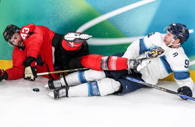 ITALY, MILAN - FEBRUARY 20, 2026: Canada s Tom Wilson (L) and Finland s Mikko Rantanen in a menâ€™s Ice hockey, Eishockey play-off semifinal match at the Milano Santagiulia Ice Hockey Arena, as part of the 2026 Winter Olympic Games, Olympische Spiele, Olympia, OS Peter Kovalev TASS  89005224