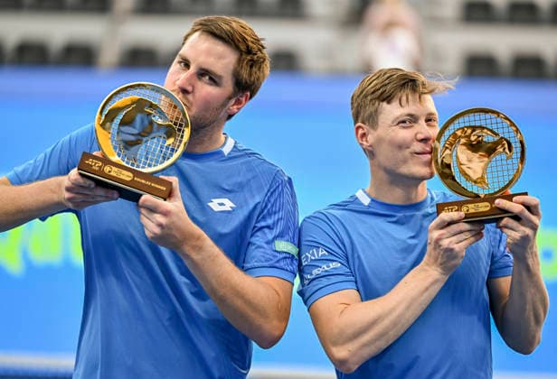 February 20, 2026, Doha, Qatar: Harri Heliovaara of Finland and Henry Patten of Great Britain pose with their trophies after winning their men™s Doubles Final match against Julian Cash and Lloyd Glasspool of Great Britain (not in view) during the ATP, Tennis Herren Qatar ExxonMobil Open 2026 tennis tournament at the Khalifa International Tennis Complex. Harri Heliovaara Henry Patten won against Julian Cash and Lloyd Glasspool 6-3.6-3. ATP Qatar Exxonmobil Open 2026 Tennis Tournament In Doha - 20 Feb 2026  - ZUMAs197 20260220_aaa_s197_048 Copyright: xNoushadxVariyattiyakkalx
