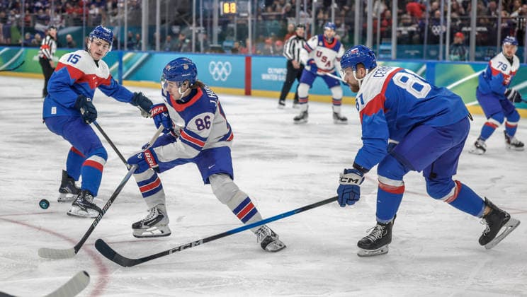 United States Jack Hughes (86) passes between Slovakia s Erik Cernak (81) and Slovakia s Dalibor Dvorsky (15) in the first period of the Men s Hockey Play-off Semifinal game between Slovakia and the USA at the Milano Santagiulia Ice hockey, Eishockey Arena in Milan, Italy, on Friday, February 20, 2026.  OLY20260220309 AARONxJOSEFCZYK