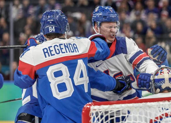 Slovakia s Pavol Regenda (84) punches United States Brady Tkachuk (7) in the first period of the Men s Hockey Play-off Semifinal game between Slovakia and the USA at the Milano Santagiulia Ice hockey, Eishockey Arena in Milan, Italy, on Friday, February 20, 2026.  OLY20260220311 AARONxJOSEFCZYK