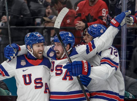 United States Dylan Larkin (21) celebrates with United States Jaccob Slavin (74) and United States Tage Thompson (72) after scoring the first goal in the first period of the Men s Hockey Play-off Semifinal game between Slovakia and the USA at the Milano Santagiulia Ice hockey, Eishockey Arena in Milan, Italy, on Friday, February 20, 2026.  OLY2026022030817 AARONxJOSEFCZYK