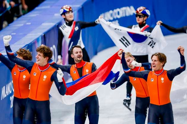 winner team of the Netherlands, Jens van t Wout of the Netherlands and Teun Boer of the Netherlands and Itzhak de Laat of the Netherlands and Friso Emons of the Netherlands and Melle van t Wout of the Netherlands celebrating and holding flag after Men s 5000m Relay Finals, Milano Cortina 2026 Winter Olympics: Day 14, Short Track Speed skating, Eisschnelllauf - Milano Cortina 2026 Winter Olympics: Day 14, Milano Speed Skating Stadium, February 20, 2026, Milan, Italy.
