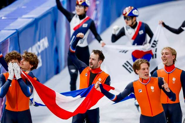 winner team of the Netherlands, Jens van t Wout of the Netherlands and Teun Boer of the Netherlands and Itzhak de Laat of the Netherlands and Friso Emons of the Netherlands and Melle van t Wout of the Netherlands celebrating and holding flag after Men s 5000m Relay Finals, Milano Cortina 2026 Winter Olympics: Day 14, Short Track Speed skating, Eisschnelllauf - Milano Cortina 2026 Winter Olympics: Day 14, Milano Speed Skating Stadium, February 20, 2026, Milan, Italy.