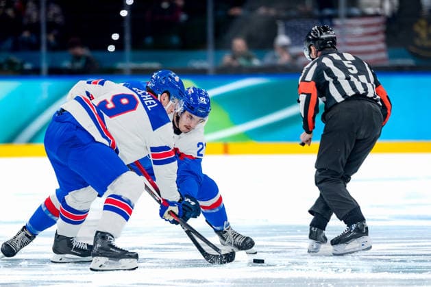 OLYMPICS - Winter Olympic Games, Olympische Spiele, Olympia, OS Milano Cortina 2026 MILAN,ITALY,20.FEB.26 - OLYMPICS, Ice hockey, Eishockey - Winter Olympic Games Milano Cortina 2026, semifinal, USA vs Slovakia, men. Image shows Jack Eichel (USA), Adam Ruzicka (SVK) and referee Chris Rooney.  GEPAxpictures xMatthiasxTrinkl