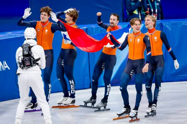 winner team of the Netherlands, Jens van t Wout of the Netherlands and Teun Boer of the Netherlands and Itzhak de Laat of the Netherlands and Friso Emons of the Netherlands and Melle van t Wout of the Netherlands celebrating and holding flag after Men s 5000m Relay Finals, Milano Cortina 2026 Winter Olympics: Day 14, Short Track Speed skating, Eisschnelllauf - Milano Cortina 2026 Winter Olympics: Day 14, Milano Speed Skating Stadium, February 20, 2026, Milan, Italy.