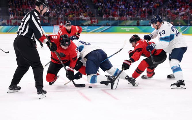 (260220) -- MILAN, Feb. 20, 2026 -- Sam Bennett (2nd L) of Canada vies for the puck during the Ice hockey, Eishockey men s play-offs semifinal match between Canada and Finland at the Milan-Cortina 2026 Olympic Winter games, Winterspiele,Spiele, Summer games in Milan, Italy, Feb. 20, 2026. ) (MICO2026)ITALY-MILAN-OLYMPIC WINTER GAMES-ICE HOCKEY-MEN-PLAY-OFFS SEMIFINALS-CAN VS FIN WangxKaiyan 
