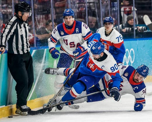 Slovakia s Tomas Tatar (90) and United States Auston Matthews (34) go down in front of United States Charlie McAvoy (25) and Slovakia s Martin Pospisil (76) in the second period of the Men s Hockey Play-off Semifinal game between Slovakia and the USA at the Milano Santagiulia Ice hockey, Eishockey Arena in Milan, Italy, on Friday, February 20, 2026.  OLY20260220324 AARONxJOSEFCZYK