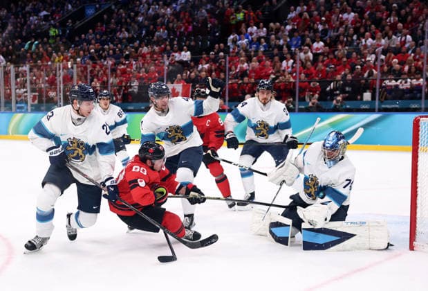 (260220) -- MILAN, Feb. 20, 2026 -- Brad Marchand (3rd L) of Canada shoots during the Ice hockey, Eishockey men s play-offs semifinal match between Canada and Finland at the Milan-Cortina 2026 Olympic Winter games, Winterspiele,Spiele, Summer games in Milan, Italy, Feb. 20, 2026. ) (MICO2026)ITALY-MILAN-OLYMPIC WINTER GAMES-ICE HOCKEY-MEN-PLAY-OFFS SEMIFINALS-CAN VS FIN WangxKaiyan 