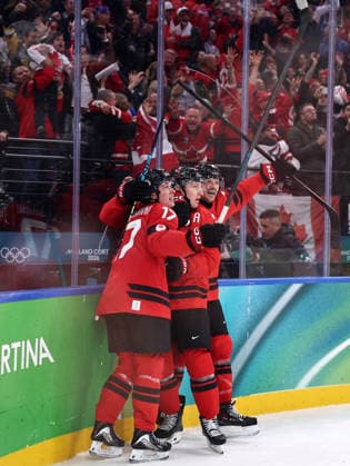 (260220) -- MILAN, Feb. 20, 2026 -- Players of Canada celebrate scoring during the Ice hockey, Eishockey men s play-offs semifinal match between Canada and Finland at the Milan-Cortina 2026 Olympic Winter games, Winterspiele,Spiele, Summer games in Milan, Italy, Feb. 20, 2026. ) (MICO2026)ITALY-MILAN-OLYMPIC WINTER GAMES-ICE HOCKEY-MEN-PLAY-OFFS SEMIFINALS-CAN VS FIN WangxKaiyan 