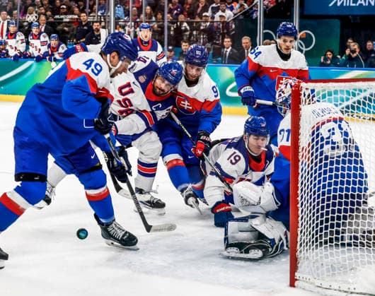 United States Brock Faber (14) battles Slovakia s Samuel Takac (49) and Slovakia s Matus Sukel (91) in front of the goal in the second period of the Men s Hockey Play-off Semifinal game between Slovakia and the USA at the Milano Santagiulia Ice hockey, Eishockey Arena in Milan, Italy, on Friday, February 20, 2026.  OLY20260220326 AARONxJOSEFCZYK