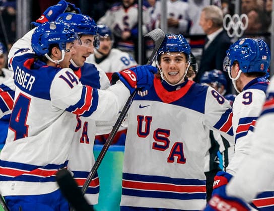 United States Jack Hughes (86) celebrates with teammates after scoring in the second period of the Men s Hockey Play-off Semifinal game between Slovakia and the USA at the Milano Santagiulia Ice hockey, Eishockey Arena in Milan, Italy, on Friday, February 20, 2026.  OLY20260220328 AARONxJOSEFCZYK