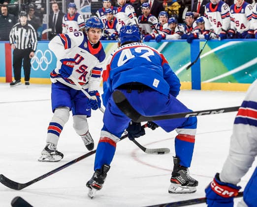 United States Jack Hughes (86) shoots on Slovakia s Martin Fehervary (42) to score a goal in the second period of the Men s Hockey Play-off Semifinal game between Slovakia and the USA at the Milano Santagiulia Ice hockey, Eishockey Arena in Milan, Italy, on Friday, February 20, 2026.  OLY20260220329 AARONxJOSEFCZYK