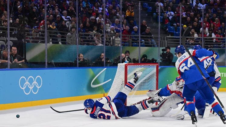 XXV Winter Olympic Games, Olympische Spiele, Olympia, OS in Milan, Italy, on February 20, 2026. Men s Ice hockey, Eishockey semifinal, USA vs Slovakia. From left Dylan Larkin of USA, goalkeeper Samuel Hlavaj of Slovakia and Patrik Koch of Slovakia. (CTKxPhoto MichalxKamaryt) CTKPhotoP2026022011363  CTKPhotoP2026022011363