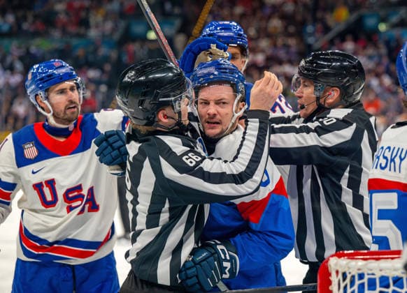 February 20, 2026, Milan, Lombardy, Italy: Referees breakup a fight between the USA and against Slovakia in the semifinal hockey game at the Milano Santaguilia Ice hockey, Eishockey Arena during the Milano Cortina 2026 Winter Olympics. Team USA won the game 6:2. Milan Italy - ZUMAh234 20260220_oly_h234_014 Copyright: xMarkxEdwardxHarrisx