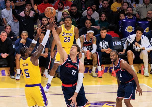 February 20, 2026, Los Angeles, California, USA: Deandre Ayton 5 of the Los Angeles Lakers puts a shot over Brook Lopez 11 of the Los Angeles Clippers during a regular season NBA, Basketball Herren, USA game on Friday February 20, 2026 at Crypto.com Arena in Los Angeles, California. JAVIER ROJAS PI Los Angeles USA - ZUMAp124 20260220_zaa_p124_035 Copyright: xJavierxRojasx