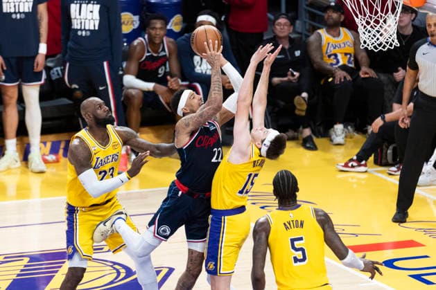 February 20, 2026, Los Angeles, California, USA: Los Angeles Clippers Jordan Miller (22) shoots against Los Angeles LakersÃ¢â‚¬â ¢ Austin Reaves (15) during an NBA, Basketball Herren, USA basketball game at Crypto.com Arena on Friday, Feb. 20, 2026 in Los Angeles. Los Angeles USA - ZUMAc68_ 20260220_zaf_c68_047 Copyright: xRingoxChiux