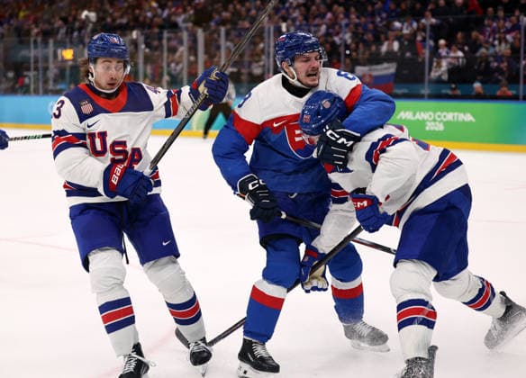 (260221) -- MILAN, Feb. 21, 2026 -- Oliver Okuliar (C) of Slovakia fights with Charlie McAvoy (R) and Quinn Hughes of the United States during the Ice hockey, Eishockey men s play-offs semifinal match between the United States and Slovakia at the Milan-Cortina 2026 Olympic Winter games, Winterspiele,Spiele, Summer games in Milan, Italy, Feb. 20, 2026. ) (MICO2026)ITALY-MILAN-OLYMPIC WINTER GAMES-ICE HOCKEY-MEN-PLAY-OFFS SEMIFINALS-USA VS SVK WangxKaiyan 