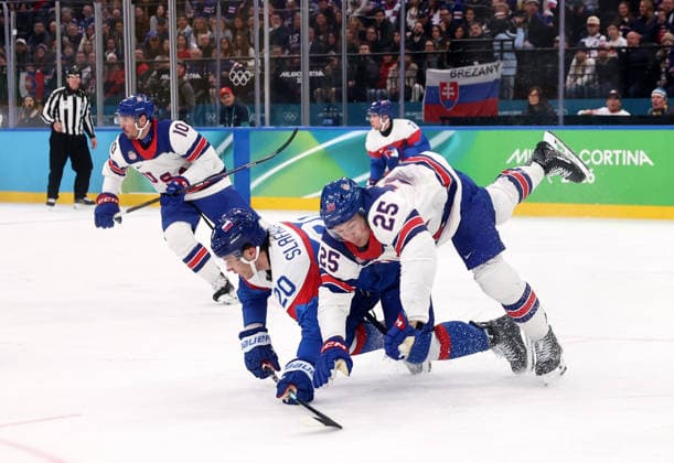 (260221) -- MILAN, Feb. 21, 2026 -- Juraj Slafkovsky (front L) of Slovakia and Charlie McAvoy (front R) of the United States fall during the Ice hockey, Eishockey men s play-offs semifinal match between the United States and Slovakia at the Milan-Cortina 2026 Olympic Winter games, Winterspiele,Spiele, Summer games in Milan, Italy, Feb. 20, 2026. ) (MICO2026)ITALY-MILAN-OLYMPIC WINTER GAMES-ICE HOCKEY-MEN-PLAY-OFFS SEMIFINALS-USA VS SVK WangxKaiyan 