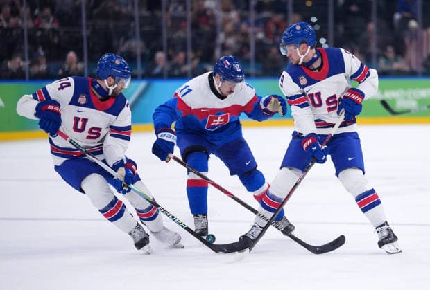 (260221) -- MILAN, Feb. 21, 2026 -- Milos Kelemen (C) of Slovakia battles for the puck with Jaccob Slavin (L) and Jack Eichel of the United States during the Ice hockey, Eishockey men s play-offs semifinal match between the United States and Slovakia at the Milan-Cortina 2026 Olympic Winter games, Winterspiele,Spiele, Summer games in Milan, Italy, Feb. 20, 2026. ) (MICO2026)ITALY-MILAN-OLYMPIC WINTER GAMES-ICE HOCKEY-MEN-PLAY-OFFS SEMIFINALS-USA VS SVK TaoxXiyi 