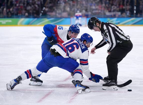 (260221) -- MILAN, Feb. 21, 2026 -- Vincent Trocheck (C) of the United States and Dalibor Dvorsky (L) of Slovakia battle for the puck during the Ice hockey, Eishockey men s play-offs semifinal match between the United States and Slovakia at the Milan-Cortina 2026 Olympic Winter games, Winterspiele,Spiele, Summer games in Milan, Italy, Feb. 20, 2026. ) (MICO2026)ITALY-MILAN-OLYMPIC WINTER GAMES-ICE HOCKEY-MEN-PLAY-OFFS SEMIFINALS-USA VS SVK TaoxXiyi 