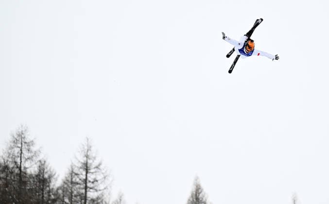(260221) -- LIVIGNO, Feb. 21, 2026 -- Xu Mengtao of China competes during the freestyle skiing mixed team aerials final 1 at the Milan-Cortina 2026 Olympic Winter games, Winterspiele,Spiele, Summer games in Livigno, Italy, Feb. 21, 2026. ) (MICO2026)ITALY-LIVIGNO-OLYMPIC WINTER GAMES-FREESTYLE SKIING-MIXED TEAM AERIALS-FINAL ZhangxHongxiang 