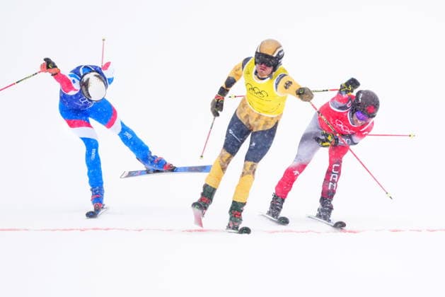 February 21, 2026, Livigno, Italy: Canada s Kevin Drury, right, reaches for the finish line as he competes during the men s skicross 1 8 finals at the Milano Cortina 2026 Winter Olympic Games, Olympische Spiele, Olympia, OS in Livigno, Italy on Saturday, Feb. 21, 2026. Canada News - February 21, 2026  - ZUMAc35_ 20260221_zaf_c35_018 Copyright: xSeanxKilpatrickx