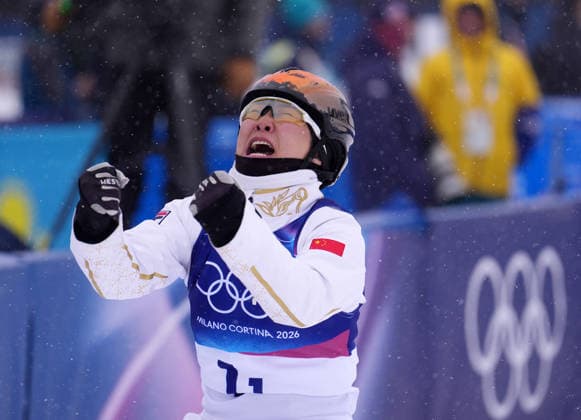 (260221) -- LIVIGNO, Feb. 21, 2026 -- Xu Mengtao of China reacts during the freestyle skiing mixed team aerials final 2 at the Milan-Cortina 2026 Olympic Winter games, Winterspiele,Spiele, Summer games in Livigno, Italy, Feb. 21, 2026. ) (MICO2026)ITALY-LIVIGNO-OLYMPIC WINTER GAMES-FREESTYLE SKIING-MIXED TEAM AERIALS-FINAL HuxChao 