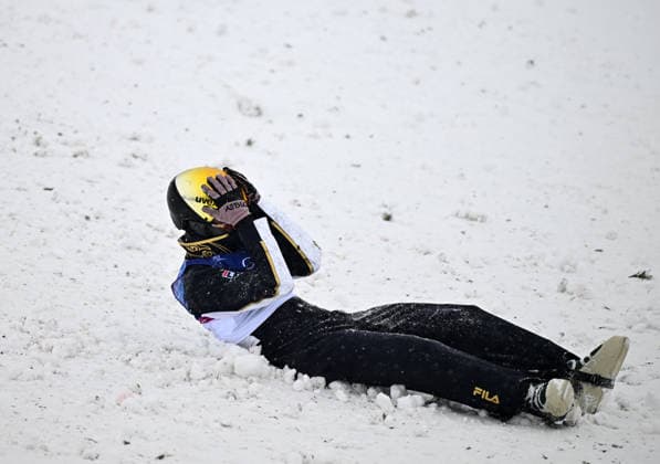 (260221) -- LIVIGNO, Feb. 21, 2026 -- Li Tianma of China reacts during the freestyle skiing mixed team aerials final 2 at the Milan-Cortina 2026 Olympic Winter games, Winterspiele,Spiele, Summer games in Livigno, Italy, Feb. 21, 2026. ) (MICO2026)ITALY-LIVIGNO-OLYMPIC WINTER GAMES-FREESTYLE SKIING-MIXED TEAM AERIALS-FINAL ZhangxHongxiang 