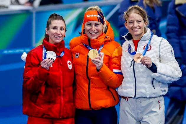 second Ivanie Blondin of Canada and winner Marijke Groenewoud of the Netherlands third Mia Manganello of United States of America smiling during the medal ceremony after Women s Mass Start Final, Milano Cortina 2026 Winter Olympics: Day 15, Speed skating, Eisschnelllauf - Milano Cortina 2026 Winter Olympics: Day 15, Milano Speed Skating Stadium, February 21, 2026, Milan, Italy.