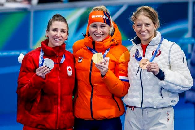 second Ivanie Blondin of Canada and winner Marijke Groenewoud of the Netherlands third Mia Manganello of United States of America smiling during the medal ceremony after Women s Mass Start Final, Milano Cortina 2026 Winter Olympics: Day 15, Speed skating, Eisschnelllauf - Milano Cortina 2026 Winter Olympics: Day 15, Milano Speed Skating Stadium, February 21, 2026, Milan, Italy.