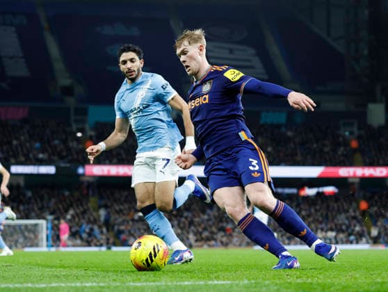 Manchester, England, 21st February 2026. Omar Marmoush of Manchester City pressures Lewis Hall of Newcastle United during the Manchester City vs Newcastle United Premier League match at the Etihad Stadium, Manchester. Picture credit should read: Cody Froggatt Sportimage EDITORIAL USE ONLY. No use with unauthorised audio, video, data, fixture lists, club league logos or live services. Online in-match use limited to 120 images, no video emulation. No use in betting, games or single club league player publications. SPI_022_CF_Man_City_Newc SPI-4542-0022