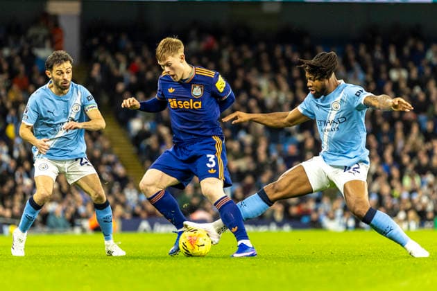 21st February 2026; Etihad Stadium, Manchester, Lancashire, England; Premier League Football, Manchester City versus Newcastle United; Lewis Hall of Newcastle United is tackled by Antoine Semenyo of Manchester City  TimxWilliams Content restricted for UK based newspaper