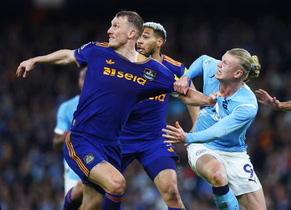 Erling Haaland of Manchester City and Dan Burn of Newcastle United Manchester City v Newcastle United, Premier League, Football, Etihad Stadium, Manchester, UK - 21 Feb 2026Manchester Etihad Stadium United Kingdom EDITORIAL USE ONLY No use with unauthorised audio, video, data, fixture lists, club league logos or live services. Online in-match use limited to 120 images, no video emulation. No use in betting, games or single club league player publications. Copyright: xMattxWest Shutterstockx 16681542ai
