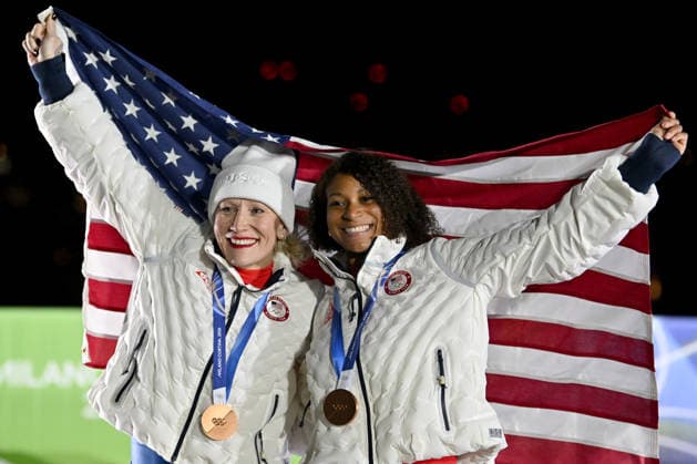 Cortina d Ampezzo, Italy, February 21th 2026. Third place Kaillie Armbruster Humphries and Jasmine Jones of United States of America celebrate in podium after the Bobsleight 2-woman Heat 3 and 4 race of the Olympic Winter games, Winterspiele,Spiele, Summer games 2026 in Cortina d Ampezzo, Italy. (Photo by Igor Kupljenik Sports Press Photo)  Copyright: xIgorxKupljenikx xSPPx Sportspressphoto_SPR95777