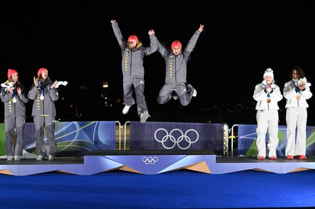 Cortina d Ampezzo, Italy, February 21th 2026. First place Laura Nolte and Deborah Levi of Germany, Second place Lisa Buckwitz and Neele Schuten of Germany and Third place Kaillie Armbruster Humphries and Jasmine Jones of United States of America celebrate in podium after the Bobsleight 2-woman Heat 3 and 4 race of the Olympic Winter games, Winterspiele,Spiele, Summer games 2026 in Cortina d Ampezzo, Italy. (Photo by Igor Kupljenik Sports Press Photo)  Copyright: xIgorxKupljenikx xSPPx Sportspressphoto_SPR95778