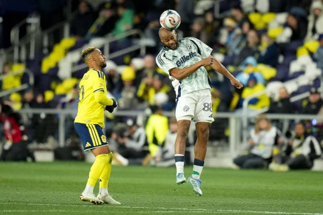 February 21, 2026, Nashville, Tennessee, USA: New England Revolution defender Andrew Farrell (88) heads the ball against Nashville SC midfielder Hany Mukhtar (10) during the second half at Geodis Park. MLS, Fussball Herren, USA Soccer 2026: New England Revolution At Nashville SC  - ZUMAh237 20260221_zsp_h237_085 Copyright: xCamdenxHallx