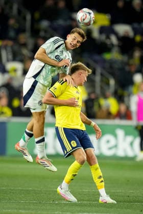 February 21, 2026, Nashville, Tennessee, USA: New England Revolution defender Keegan Hughes (5) and Nashville SC forward Sam Surridge (9) go up for a header during the second half at Geodis Park. Nashville USA - ZUMAh237 20260221_zsp_h237_075 Copyright: xCamdenxHallx