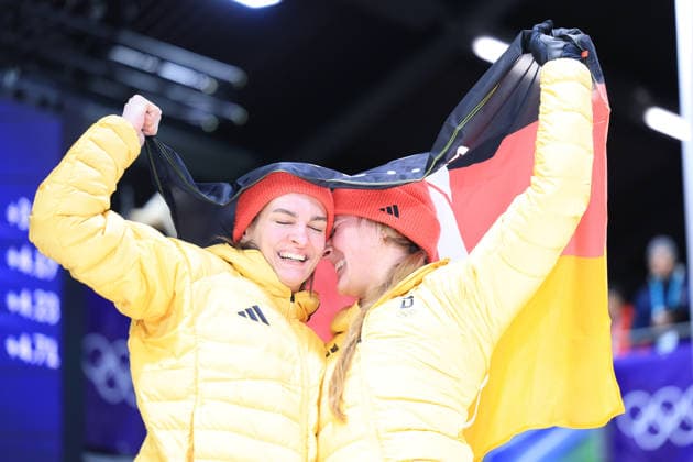 (260222) -- CORTINA D AMPEZZO, Feb. 22, 2026 -- Lisa Buckwitz (R) Neele Schuten of Germany celebrate after the Bobsleigh 2-woman heat 4 at the 2026 Milan-Cortina Winter Olympics in Cortina, Italy, Feb. 21, 2026. ) (MICO2026)ITALY-CORTINA D AMPEZZO-OLYMPIC Winter games, Winterspiele,Spiele, Summer games BOBSLEIGH-2-WOMAN DingxXu 