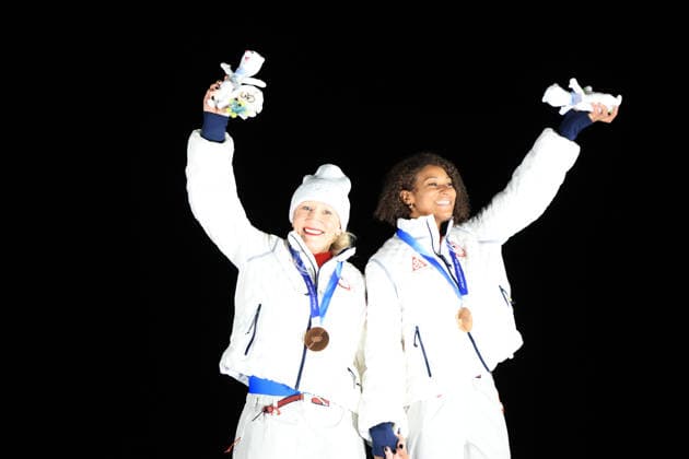 (260222) -- CORTINA D AMPEZZO, Feb. 22, 2026 -- Bronze medalists Kaillie Armbruster Humphries (L) Jasmine Jones of the United States celebrate during the awarding ceremony for the Bobsleigh 2-woman at the 2026 Milan-Cortina Winter Olympics in Cortina, Italy, Feb. 21, 2026. ) (MICO2026)ITALY-CORTINA D AMPEZZO-OLYMPIC Winter games, Winterspiele,Spiele, Summer games BOBSLEIGH-2-WOMAN DingxXu 