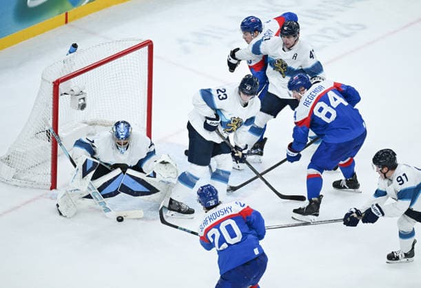 (260222) -- MILAN, Feb. 22, 2026 -- Juraj Slafkovsky (bottom) of Slovakia shoots during the Ice hockey, Eishockey men s bronze medal game between Slovakia and Finland at the Milan-Cortina 2026 Olympic Winter games, Winterspiele,Spiele, Summer games in Milan, Italy, Feb. 21, 2026. ) (MICO2026)ITALY-MILAN-OLYMPIC WINTER GAMES-ICE HOCKEY-MEN-BRONZE MEDAL GAME-SVK VS FIN ZhangxHaofu 