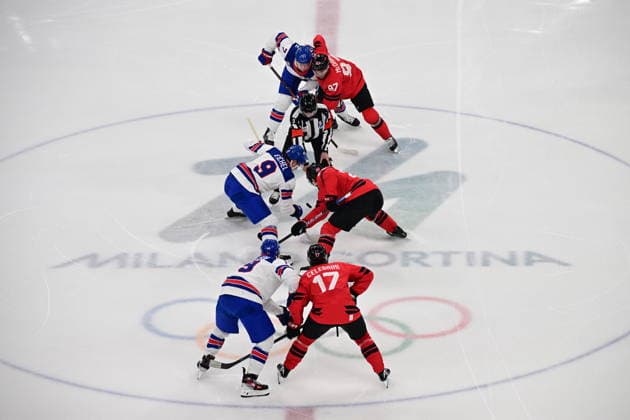 XXV Winter Olympic Games, Olympische Spiele, Olympia, OS in Milan, Italy, on February 22, 2026. Men s Ice hockey, Eishockey final, Canada vs USA. From left, upper row: Brady Tkachuk (USA) and Connor McDavid (CAN), middle row: Jack Eichel (USA) and Nathan MacKinnon (CAN), bottom row: Matthew Tkachuk (USA) and Macklin Celebrini (CAN) at the initial throw-in. (CTKxPhoto MichalxKamaryt) CTKPhotoP2026022203569  CTKPhotoP2026022203569