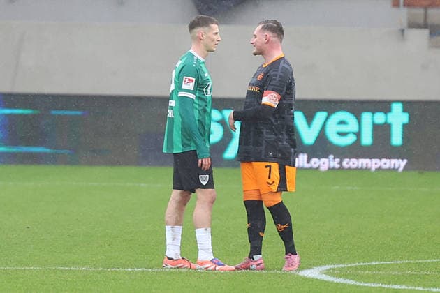 22.02.2026, xrekx, Fussball 2.Bundesliga, Preußen Münster - 1.FC Kaiserslautern v.l. Tobias Raschl (Preussen Muenster) Marlon Ritter (1.FC Kaiserslautern) nach dem Elfmeter (DFL DFB REGULATIONS PROHIBIT ANY USE OF PHOTOGRAPHS as IMAGE SEQUENCES and or QUASI-VIDEO) Münster