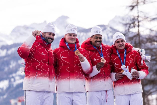 CORTINA, ITALY - FEBRUARY 22: Bronze medalists Michael Vogt Andreas Haas Amadou David Ndiaye Mario Aeberhard (Switzerland) during the Bobsleigh 4-man medal ceremony at the Milano Cortina 2026 Olympics at Cortina Sliding Centre on day 16 of the Milano Cortina 2026 Olympics on February 22, 2026 in Cortina, Italy. Editorial use only. Italy Copyright: xSteffiexWunderlx