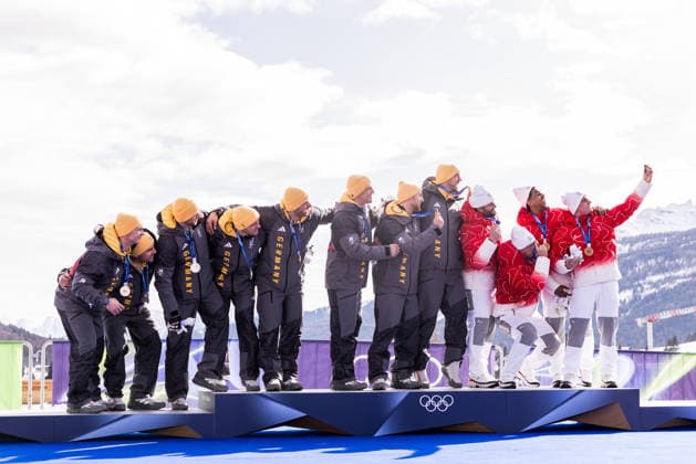 CORTINA, ITALY - FEBRUARY 22: The podium - Silver Francesco Friedrich Matthias Sommer Alexander Schueller Felix Straub (Germany), Gold Johannes Lochner Thorsten Margis Jorn Wenzel Georg Fleischhauer (Germany) and Bronze Michael Vogt Andreas Haas Amadou David Ndiaye Mario Aeberhard (Switzerland) takes a selfie together during the Bobsleigh 4-man medal ceremony at the Milano Cortina 2026 Olympics at Cortina Sliding Centre on day 16 of the Milano Cortina 2026 Olympics on February 22, 2026 in Cortina, Italy. Editorial use only. Italy Copyright: xSteffiexWunderlx