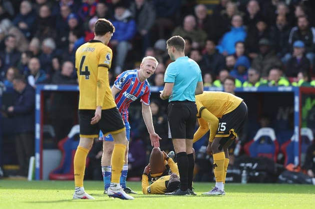 22nd February 2026; Selhurst Park, Selhurst, London, England; Premier League Football, Crystal Palace versus Wolverhampton Wanderers; Will Hughes of Crystal Palace explains to referee Thomas Kirk why he he thinks he should not had received a yellow card for a foul on Jean-Ricner Bellegarde of Wolverhampton Wanderers  KatiexChan Content restricted for UK based newspaper