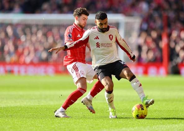 Mohamed Salah of Liverpool competes for the ball with Neco Williams of Nottingham Forest Nottingham Forest v Liverpool, Premier League, Football, City Ground, Nottingham, UK - 22 Feb 2026Nottingham City Ground United Kingdom EDITORIAL USE ONLY No use with unauthorised audio, video, data, fixture lists, club league logos or live services. Online in-match use limited to 120 images, no video emulation. No use in betting, games or single club league player publications. Copyright: xMichaelxZemanek Shutterstockx 16681559k
