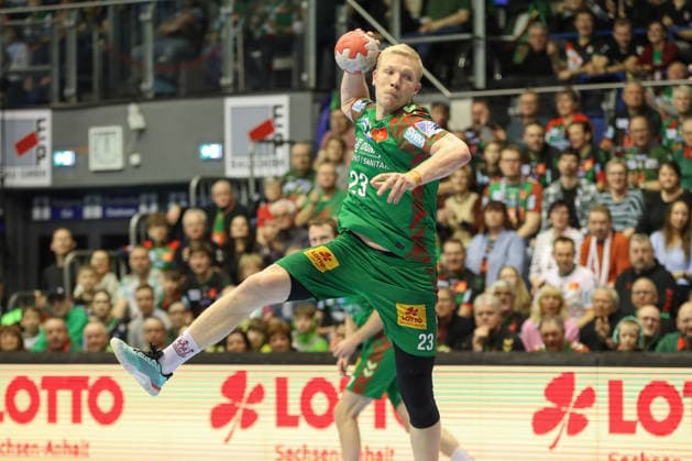 22.02.2026, xgox, Handball - Daikin HBL SC Magdeburg - GWD Minden emspor, v.l. Magnus Saugstrup (Magdeburg, 23) wirft Tor, Torschuetze, erzielt Tor, Treffer, scores the goal Magdeburg