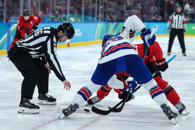 Disputed disk by USA s Brock Nelson and Canada s Nathan MacKinnon during the Olympic Winter games, Winterspiele,Spiele, Summer games Milano-Cortina 2026, Men s Ice hockey, Eishockey Final - Canada vs USA on February 22, 2026 at Milano Santagiulia Ice Hockey Arena in Milan, Italy  Copyright: xFabrizioxCarabelli IPAxSportx xipa-agency.netx xx IPA_71872102 IPA_Agency_IPA71872102