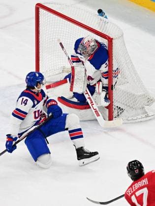 XXV Winter Olympic Games, Olympische Spiele, Olympia, OS in Milan, Italy, on February 22, 2026. Men s Ice hockey, Eishockey final, Canada vs USA. From left: Brock Faber (USA), goalkeeper Connor Hellebuyck (USA) and Macklin Celebrini (CAN). (CTKxPhoto MichalxKamaryt) CTKPhotoP2026022204306  CTKPhotoP2026022204306