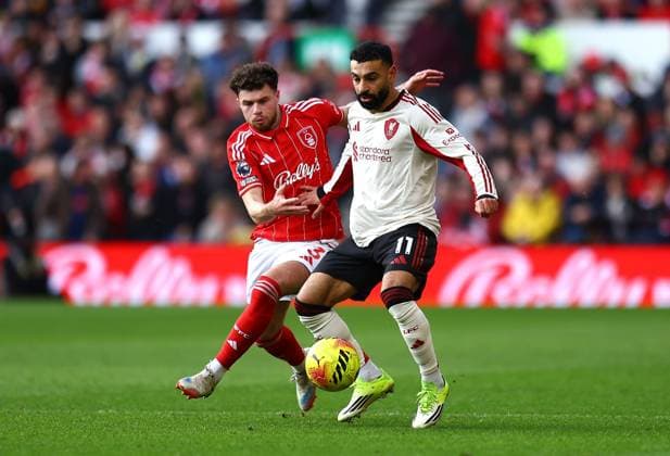 Mohamed Salah of Liverpool competes for the ball with Neco Williams of Nottingham Forest Nottingham Forest v Liverpool, Premier League, Football, City Ground, Nottingham, UK - 22 Feb 2026Nottingham City Ground United Kingdom EDITORIAL USE ONLY No use with unauthorised audio, video, data, fixture lists, club league logos or live services. Online in-match use limited to 120 images, no video emulation. No use in betting, games or single club league player publications. Copyright: xMichaelxZemanek Shutterstockx 16681559v